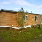 New stained log siding